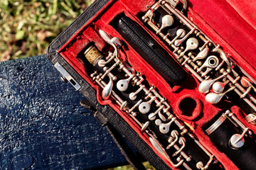 Obraz premium Musical wind instrument oboe in original red case. Musical concert symphonic background.