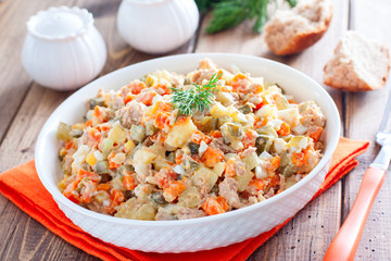 Rice salad with tuna, cherry tomatoes, kidney bean, sweet corn, red onion, spices and fresh parsley. Home made food. Symbolic image. Concept for a tasty and healthy meal. White background. Close up.
