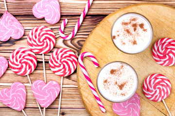 Glass of eggnog and candy cane.