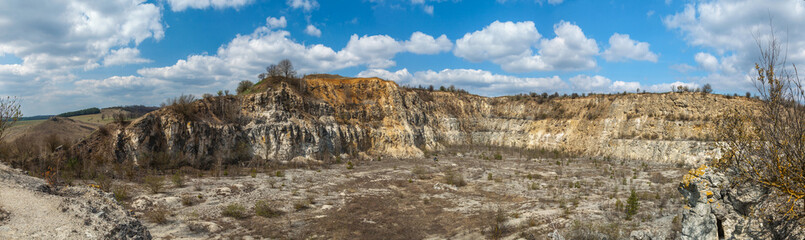 Fototapeta na wymiar Old large abandoned quarry