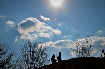 girls on a stone at noon