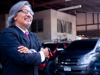 garage worker concept.Smiling happy mechanic technician worker at car repair service station