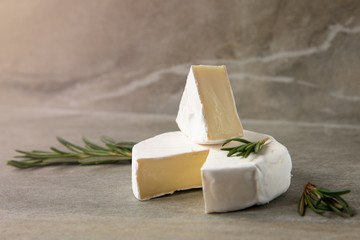 Cheese camembert or brie with fresh rosemary