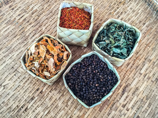 Aromatic spices in coconut weave and bamboo weave. (spices, herbs),soft focus