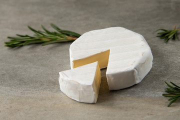 Cheese camembert or brie with fresh rosemary
