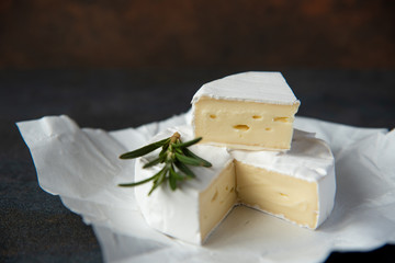 Cheese camembert or brie with fresh rosemary