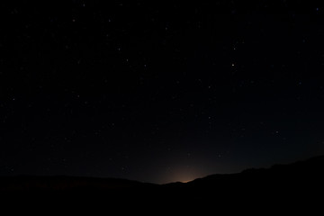 night photos on the Teide volcano in Tenerife. Images of the starry sky at night with the glow of...