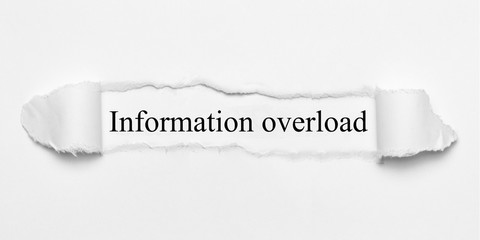 Obraz premium Information overload on white torn paper