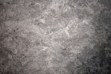 A grey marble stone with cracked