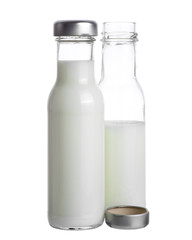 Milk in bottle glass isolated on white background.