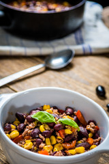 Chili corn carne on wood table