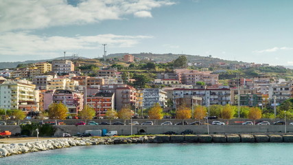 Obraz premium 16329_Tall_buildings_on_the_side_of_the_road_going_to_the_port_in_Italy.jpg