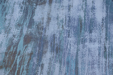 close up of faded blue vertical paint streak abstract pattern
