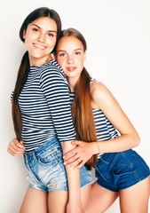 Fototapeta premium best friends teenage girls together having fun, posing emotional on white background, besties happy smiling, lifestyle people concept