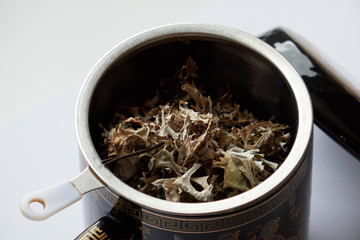 Tea ceremony , sieve with dry flower tea leaves , Asia culture design concept tea cup