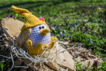 Pretty Knitted handmade bird.  Beautiful knitted chicken in the nest. Handmade toy bird.