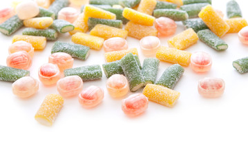 Different sweet candies on white background