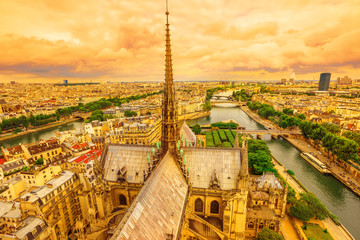 Panoramic aerial view of the spire of Notre Dame cathedral with statues, in Paris city capital of...