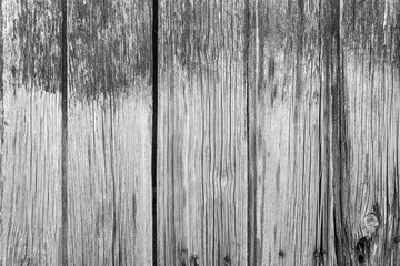 Old dirty cracked painted wooden background texture black and white gray close-up