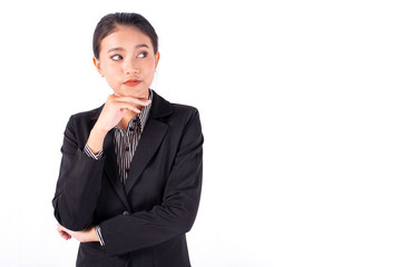 Portrait isolated Southeast Asian business woman wears dark gray suit is looking at right side and place her hand on chin with white background