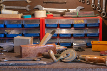 old rustic hand tools on the workshop table
