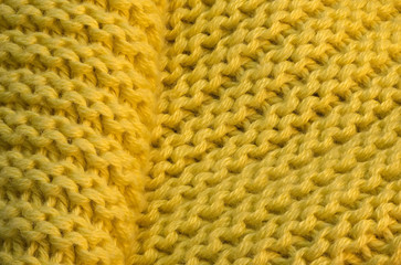 Artistic background from yellow knitted