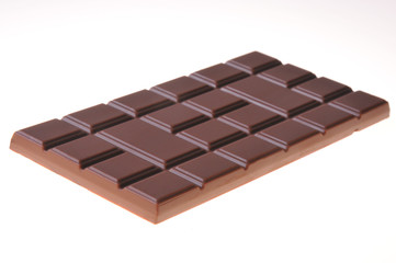 Bar of chocolate on a white background. Close-up