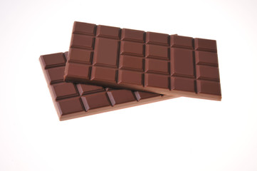 Bar of chocolate on a white background. Close-up