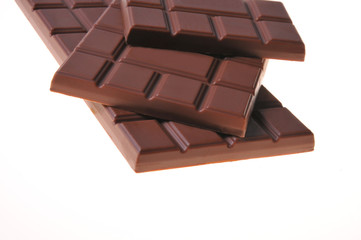 Bar of chocolate on a white background. Close-up
