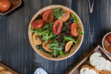 flat lay vegetable salad on bowl and bread