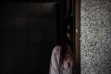 Portrait of asian woman make up ghost face with blood,Horror scene,Scary background,Halloween...