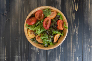 flat lay vegetable salad on bowl and bread