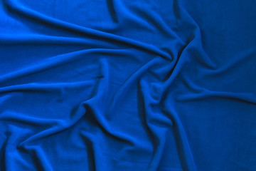 Wavy texture of bright blue fleece,