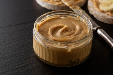 Peanuts and Fresh Peanut Butter Isolated Black Background Protein Super Food Snack with copy space