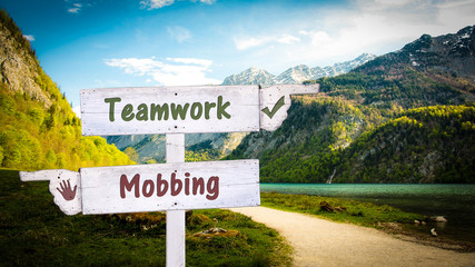 Street Sign Teamwork versus Mobbing