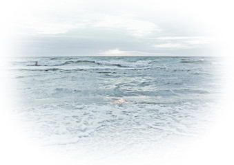 Light turquoise photo of the sea and sky with vignette. Background for tourism postcards and print design with waves by the shore and the beach. Sunset in the ocean.