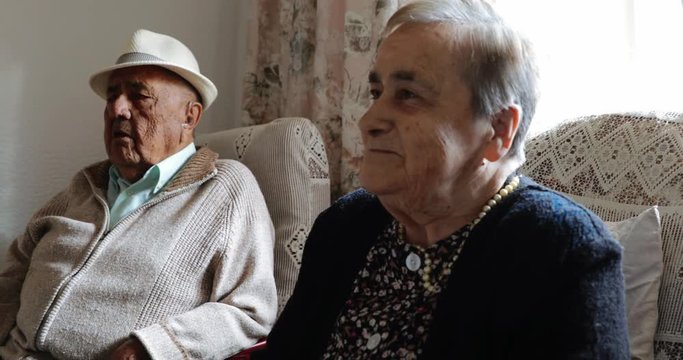 Elderly couple together at home