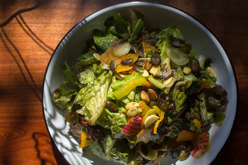 Garden salad with beets, bell pepper, pumpkin seeds, carrot, romaine lettuce and balsamic vinaigrette.