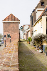 city wall with tower and houses in Leerdam, The Netherlands