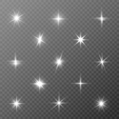 A set of bright beautiful stars. Light effect. Bright Star. Beautiful light for illustration. Christmas star.White sparkles shine special light effect. Vector sparkles on a transparent background.