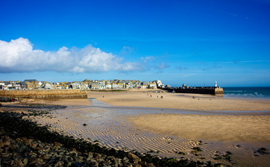 The sandy beach that is St Ives harbour at low tide, Cornwall, England, UK.