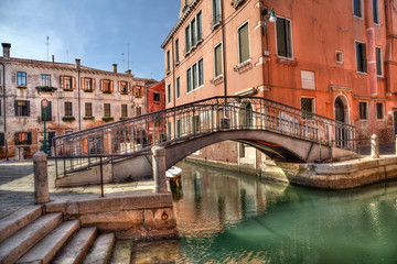 Fototapeta na wymiar Small bridge and canal in Venice, Italy