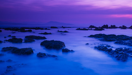 Obraz premium sunset and waves on the beach in biarritz france