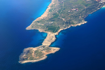 View from an airplane of island of Cyprus. Seacoast line with blue Mediterranean sea