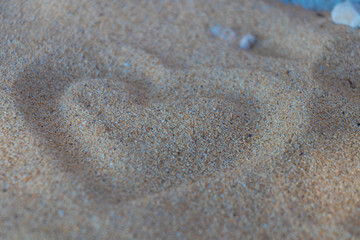 Fototapeta na wymiar Heart shape in the sand