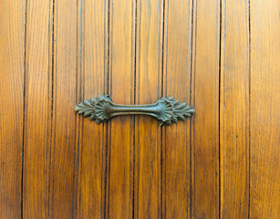 Decorated brass door handle