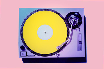 Obraz premium Vintage DJ Turntable with Yellow Vinyl 