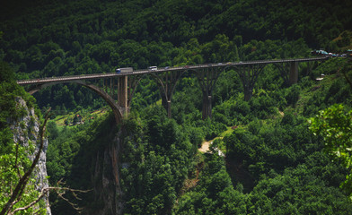 Famous arched concrete bridge in Montenegro - Dzhurdzhevicha Bridge on the river Tara. River canyon. 