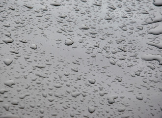 Water droplets on shiny metal surface