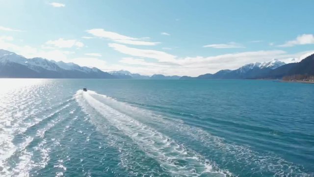 Small charter boats taking tourists out to see the wildlife and scenery of Alaska 